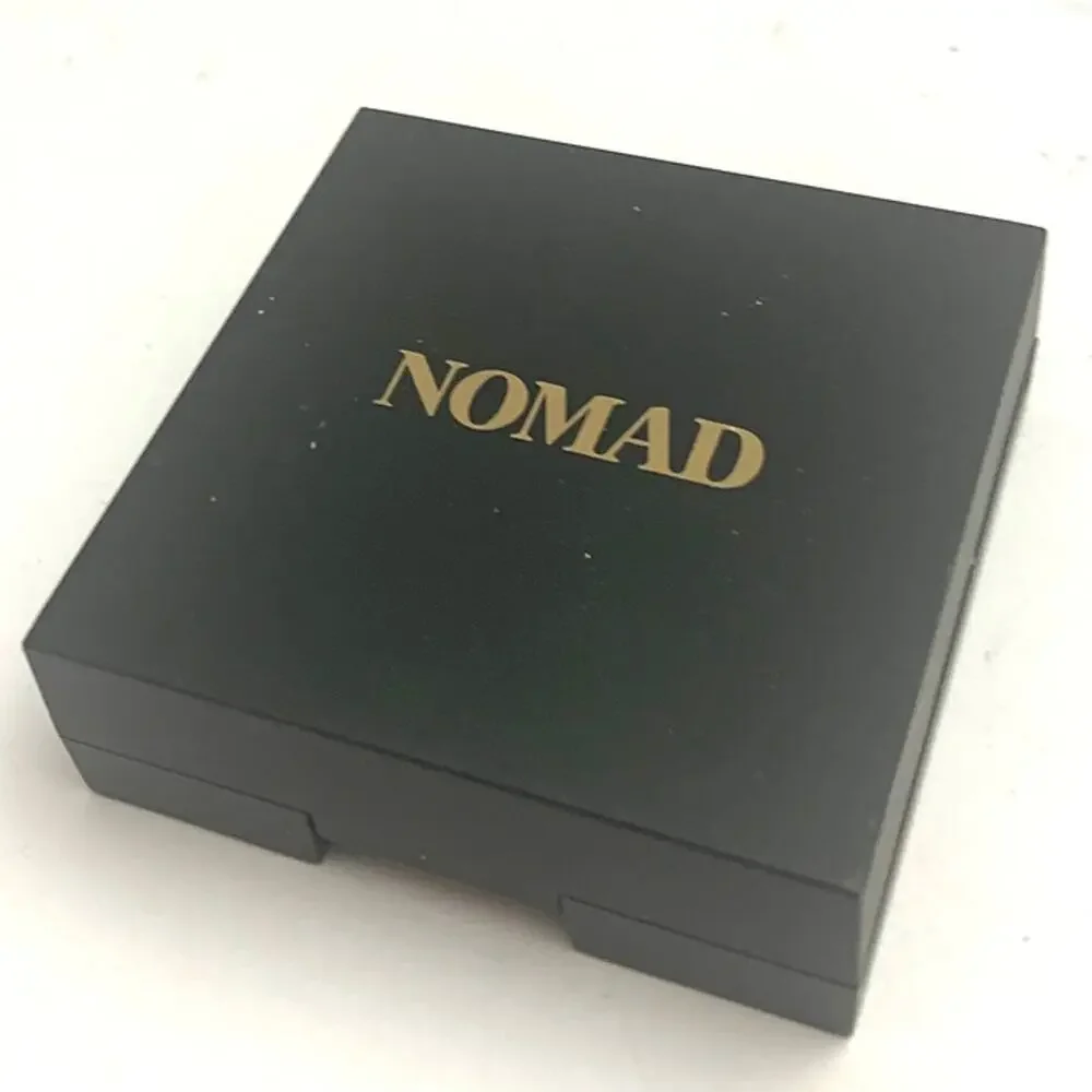 NOMAD Cosmetics Intense Eyeshadow Single in a metallic lime/green shimmer shade